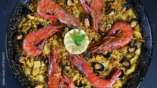 Seafood and rice paella with prawns close up photo