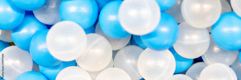The background is made of plastic whites. Blue balls in the playroom The background is made of plastic whites. Blue balls in the playroom