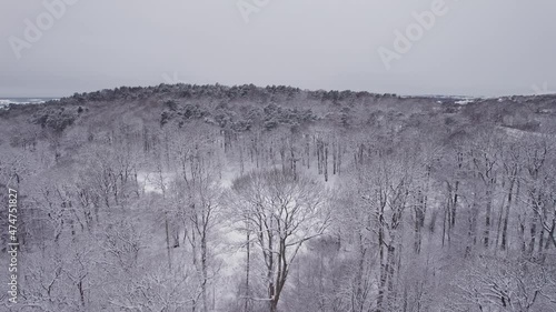 Aerial view of a snowy park in Gothenburg in December. Billdals Park. 4K drone footage.
