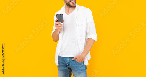 cropped happy man with coffee cup. young guy drink coffee