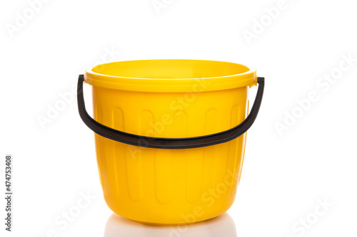 empty plastic yellow bucket on white isolated background © Ivan Traimak