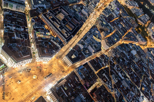 Night aerial views of Puerta del sol and its confluence with Calle Alcalá and Carrera de San Jerónimo in the city of Madrid