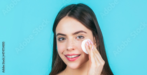 Portrait woman using sponge. Beautiful brunette woman with clean perfect fresh skin using cotton pad skin care concept. Concept of beauty, health treatment. Cosmetology and spa. Using makeup sponge