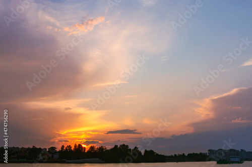 beautiful cirrus clouds illuminated by the setting summer sun