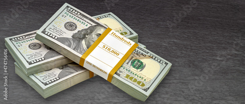 New design US American dollar bundles on black background or table. 