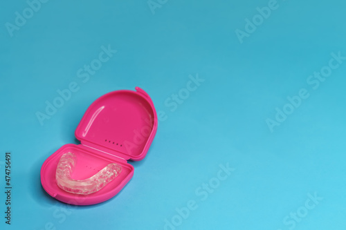 dental retainer teeth in a pink boxset photo