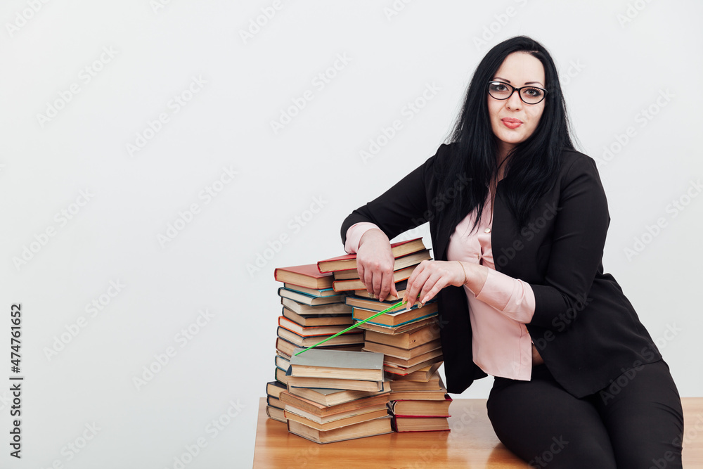 female teacher in college table with books for learning female teacher in college table with books for learning