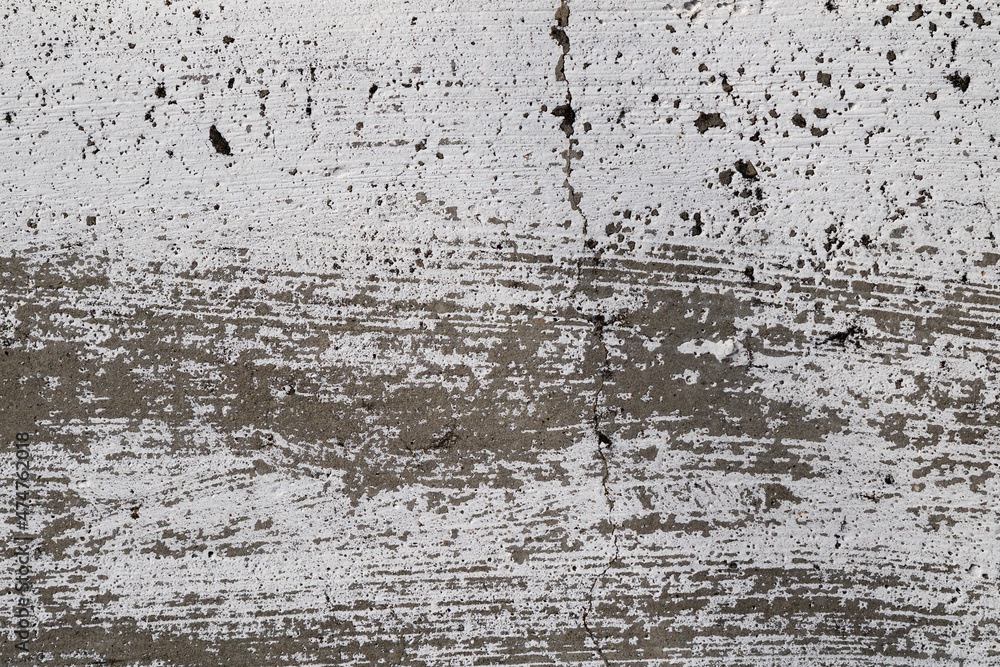 Fototapeta premium Cracked and abstract grunge texture. Aged material surface backdrop. Weathered effect pattern. Old and dirty background.