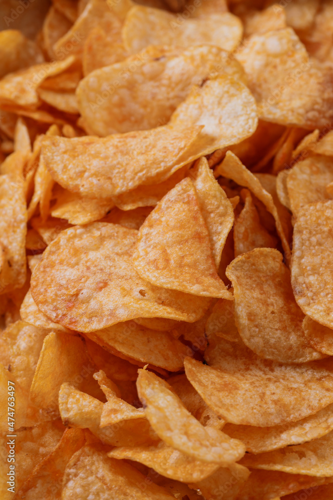 Potato chips or crisps . Close-up of potato chips or crisps. Food background.