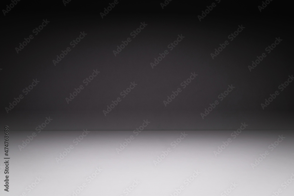 Gray concrete wall and floor background for product display.