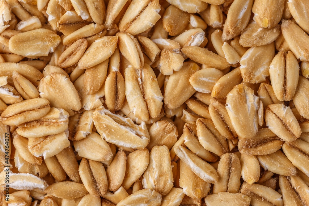 Rolled oat, oat flakes background or texture. Close up, directly above.Heap of dry rolled oats isolated. Rolled oat, oat flakes background or texture. Close up, directly above.Heap of dry rolled oats isolated.