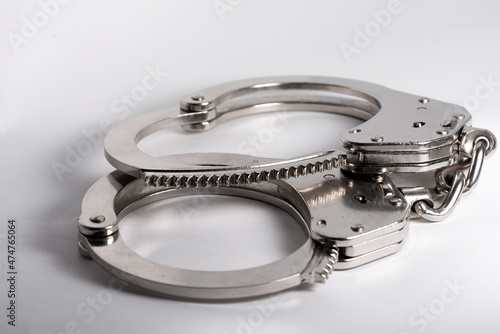 Police handcuffs. A measure of direct coercion. A tool used by the police to limit the freedom and movement of detained persons and criminals.