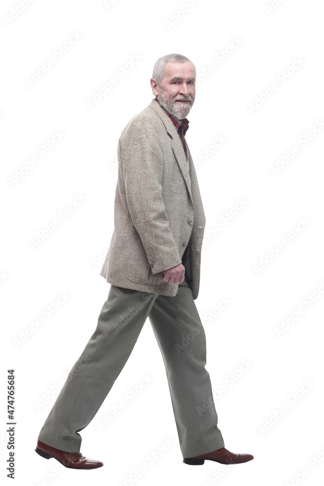 in full growth. confident old man striding forward . in full growth. confident old man striding forward .
