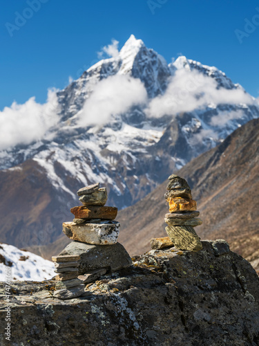 view to mountain summit through two prayer stones in Nepal