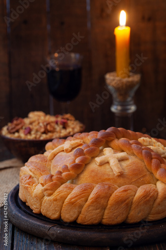 Serbian slava cake with wheat and candle.  Slavski kolač. Decorative bread for traditional celebration.