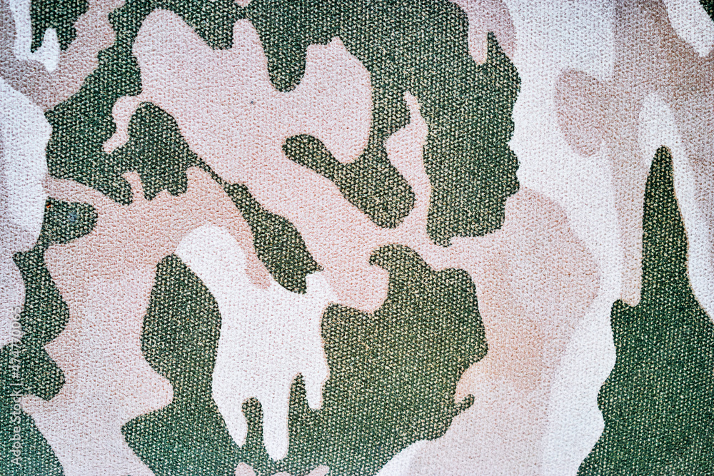 Fototapeta premium Military dusty-white-green fabric camoflauge texture pattern.