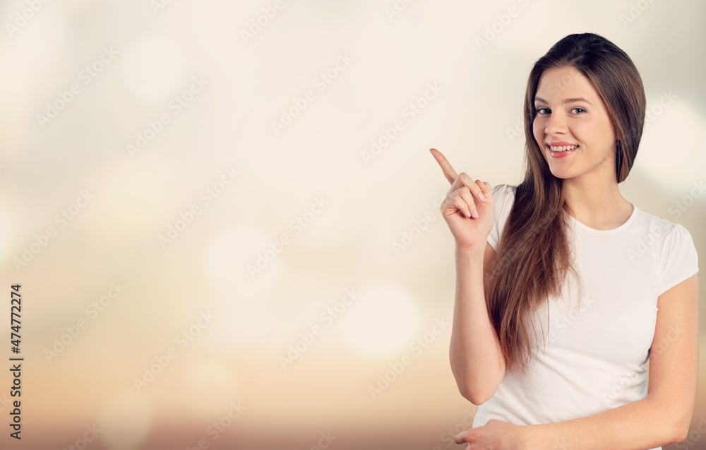 Happy woman point finger with excited cheerful smile. Happy woman point finger with excited cheerful smile.