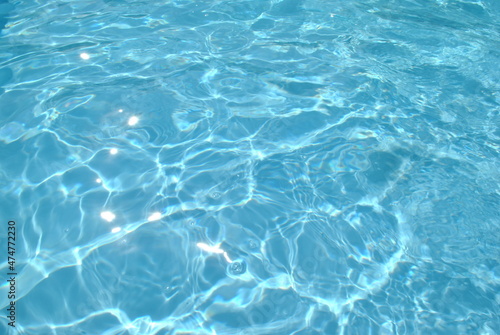 Solar glare on the water in the pool.blue