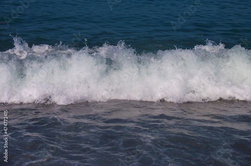 Sea wave with white foam. Blue sea. Sea coast. Russia  Sochi.