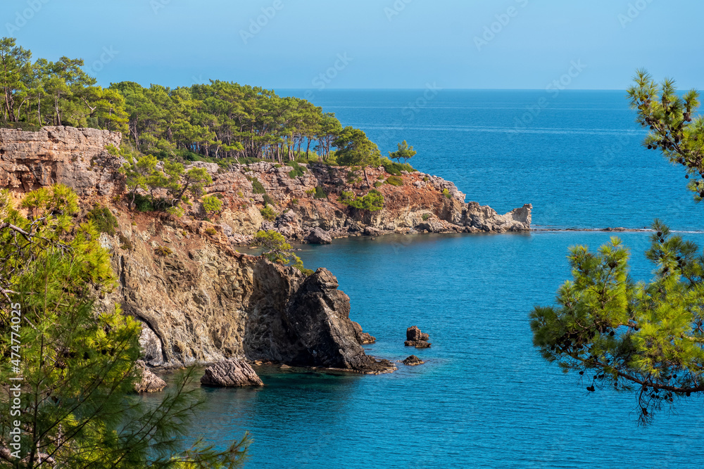 Mediterranean seascape with steep wooded coast
