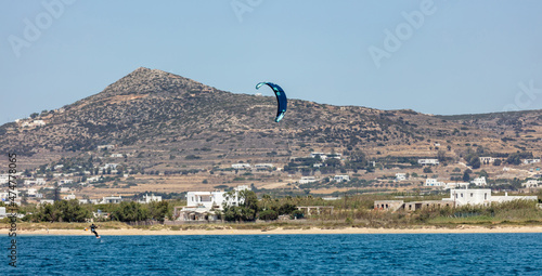 Kitesurfing kiteboarding in Aegean sea at Pounta beach, Paros island Cyclades destination Greece.