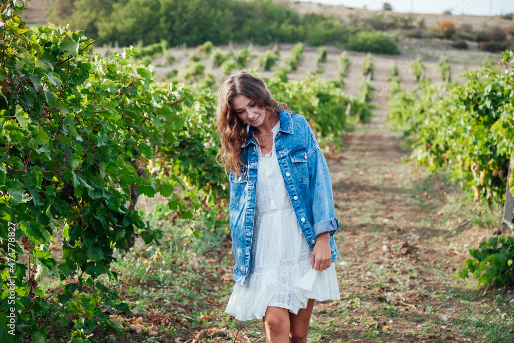 beautiful blonde woman picks grapes harvesting nice