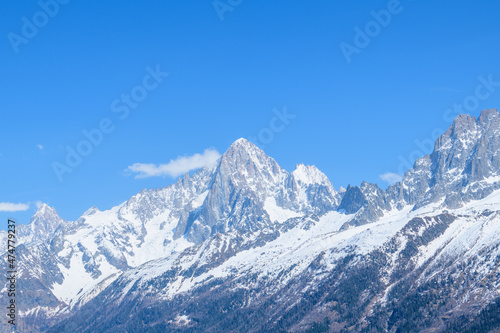 The panoramic view of the Aiguille Verte and the Aiguille du Dru in the Mont Blanc massif in Europe, France, the Alps, towards Chamonix, in spring, on a sunny day. © Florent