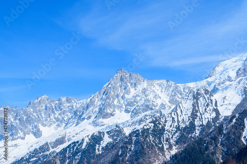 The Aiguille du Midi and its countryside in the Mont Blanc massif in Europe, France, the Alps, towards Chamonix, in spring, on a sunny day.