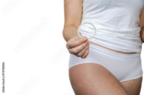 Woman Holding Vaginal Ring For Contraceptive Use isolated on white background,