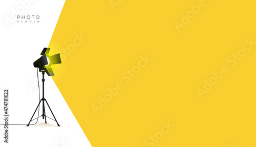 Photo studio lamp. Spotlight concept. Spotlight shines with yellow light from the left side. Place for text for your design. Vector illustration photo studio flashes light bulb icon.