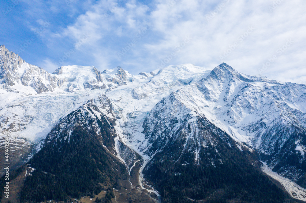 The snow-capped Mont Blanc massif in Europe, France, the Alps, towards Chamonix, in spring, on a sunny day.