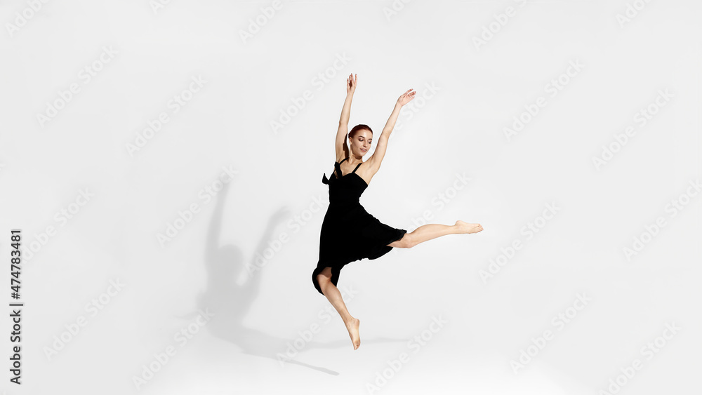 Pretty ballerina dancing ballet dance in studio Pretty ballerina dancing ballet dance in studio