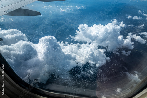 View of sky and clouds through the airplane window
