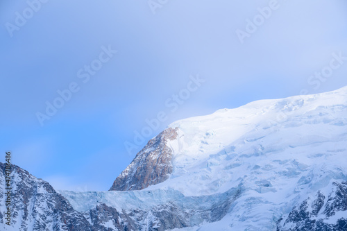 The panoramic view of the Col du Midi and Mont Blanc du Tacul in Europe  France  the Alps  towards Chamonix  in spring  on a sunny day.