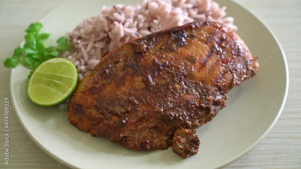 jerk chicken with rice or spicy grilled chicken in jamaica style jerk chicken with rice or spicy grilled chicken in jamaica style