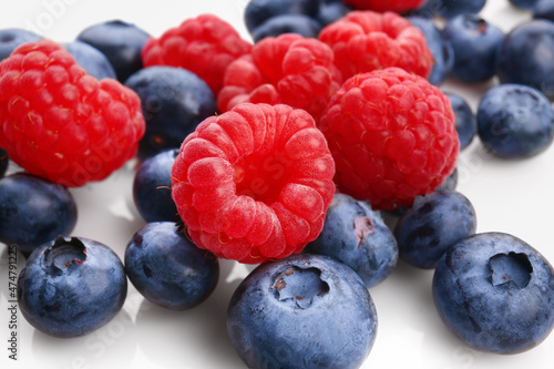 Tasty ripe berries on white background, closeup