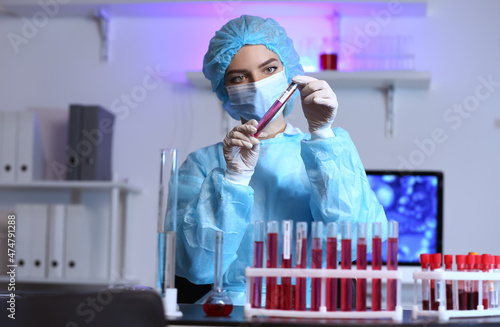 Scientist with sample of co...