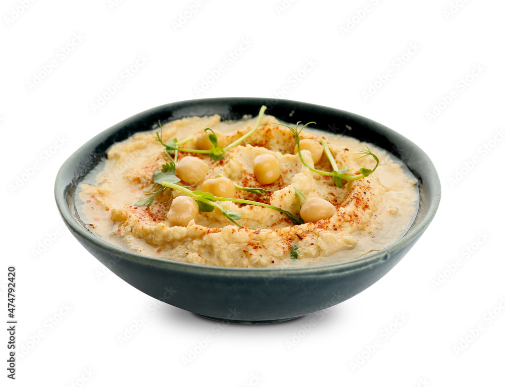 Bowl with delicious hummus on white background