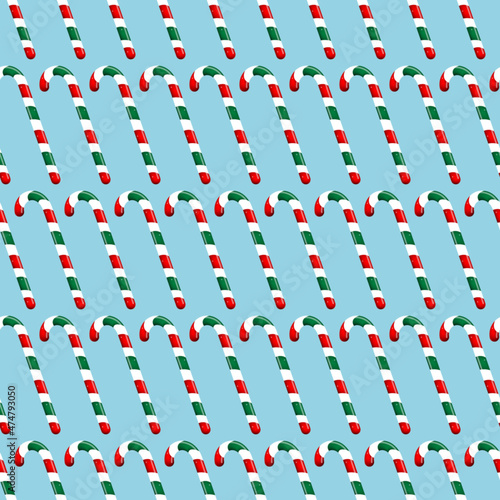 Candy cane seamless pattern, blue background, vector illustration.