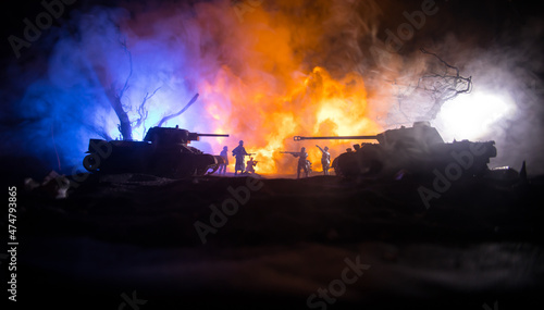 War Concept. Military silhouettes fighting scene on war fog sky background, World War Soldiers Silhouette Below Cloudy Skyline At night. Battle in ruined city. Selective focus photo