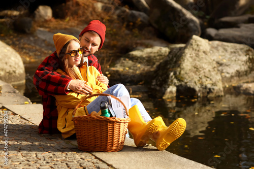 Young loving couple sitting...