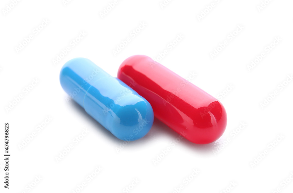 Blue and red pills on white background. Concept of choice Blue and red pills on white background. Concept of choice