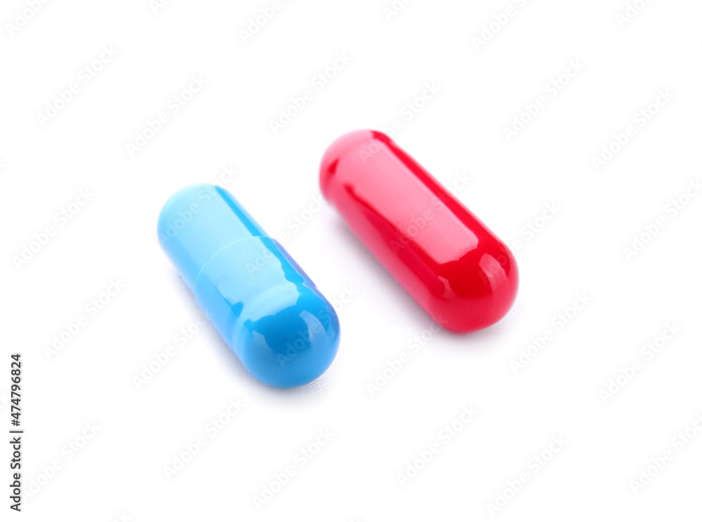 Blue and red pills on white background. Concept of choice Blue and red pills on white background. Concept of choice