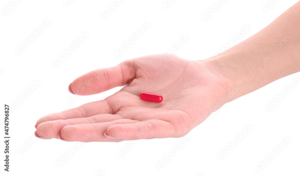 Hand with red pill isolated on white Hand with red pill isolated on white
