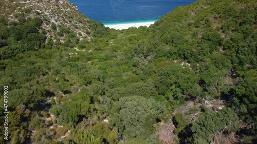 Stunning view of Fteri beach in hidden bay. Kefalonia, Greece. Surrounded by mediterranean vegetation.Trekking path, amazing seascape photo