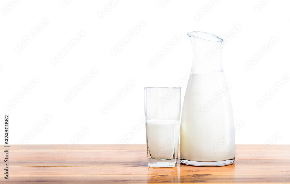 Fresh milk in glass and bottle on table isolated Fresh milk in glass and bottle on table isolated