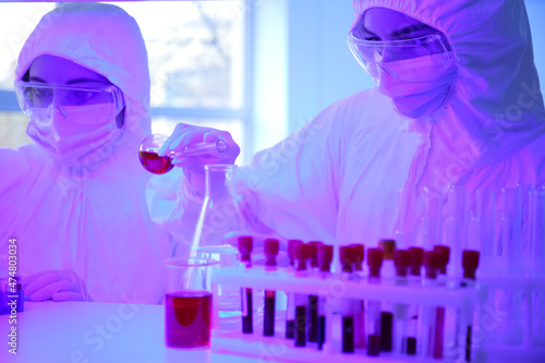 Scientists working with sam...