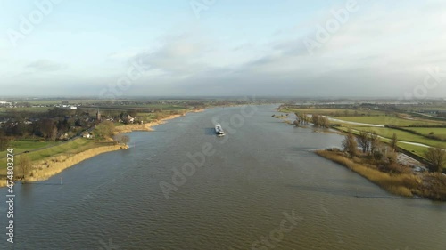 Scenic aerial drone view of big boat sailing Lek river in Ameide dutch city photo