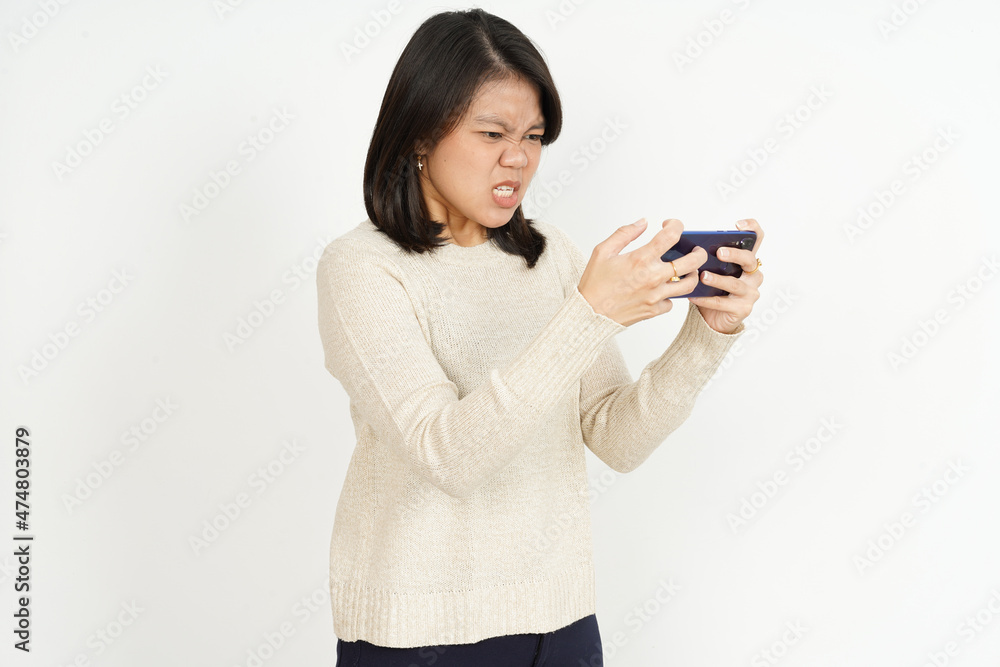 Playing Mobile Game on smartphone of Beautiful Asian Woman Isolated On White Background Playing Mobile Game on smartphone of Beautiful Asian Woman Isolated On White Background