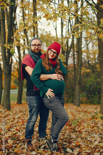 Elegant couple spend time in a autumn park © prostooleh